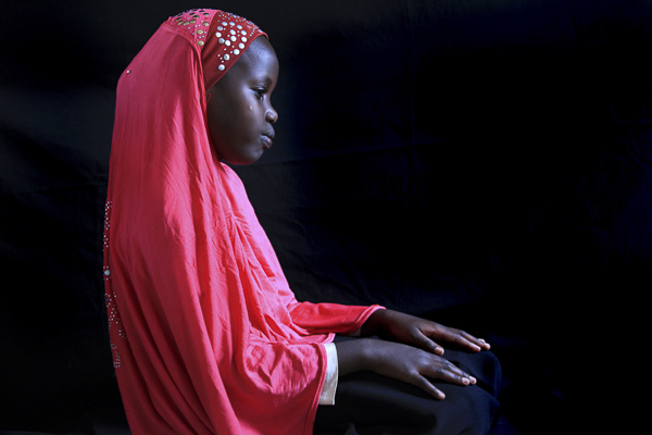 Portrait by Odilla Umuziranenge. Orphaned at a young age, Odilla has been participating in "Through the Eyes of Hope" for over seven years and now runs the studio most days. When I first saw this portrait she created last week, I was stunned by the beauty and solemnity of it.  Odila's photographic progress only affirmed my decision to come back and teach in Rwanda again this year.