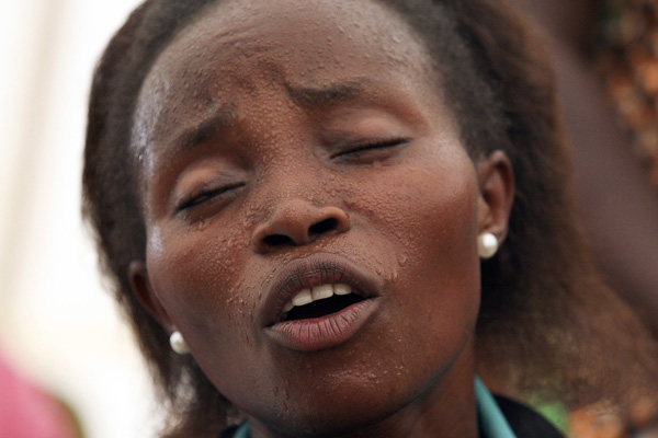 This image, made by Odilla Umuzirangenge, was one of my favorite to come out of an assignment the students were given to photograph at their church.  The photo is of a choir member singing at the end of a three plus hour pentacostal service (which I too attended with my student) held in a tent whose temperature rose and rose throughout the service.  I thought this photo really captured the passion with which she approached her singing and praising.
