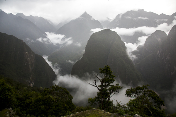 A view of the shrouded Andean mountains surrounding Machu Pichu. 