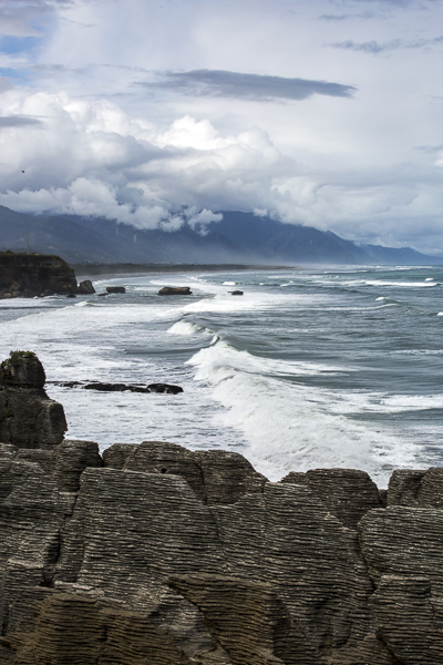 The west coast's waters, turbulent and unbridled, have worn limestone rocks into strange formations like a pile of pancakes, appropriately nicknamed "Pancake Rocks".