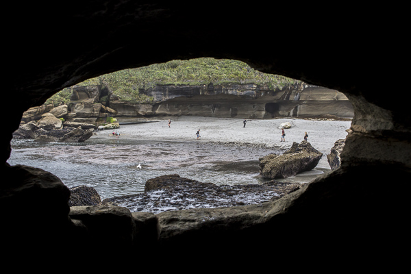 Looking out of a an ocean cave--accessible only at lowtide-- onto one of South Island's more protected west coast beaches.