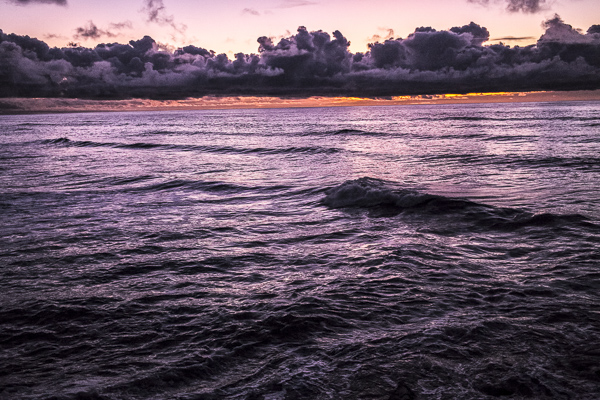 Dramatic clouds form above the Tasman Sea at sunset in Gryemouth.