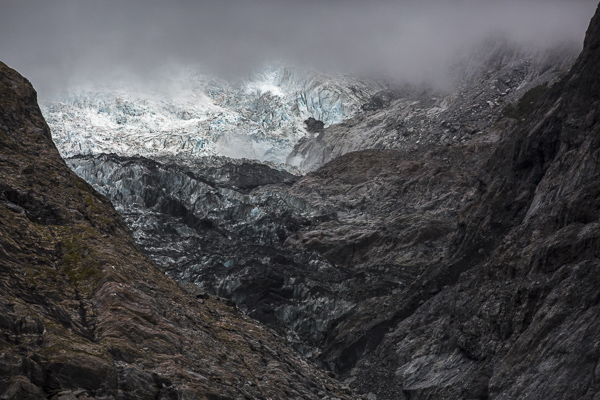 Franz Josef's ice-blue glacial face rises up out of steel-grey rock--a scene so unexpectedly after one emerges from the nearby rainforest hike. 