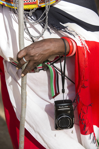 Maria Letiwe, one of the most enthusiastic of the elder women, proudly dons her camera during the workshop.